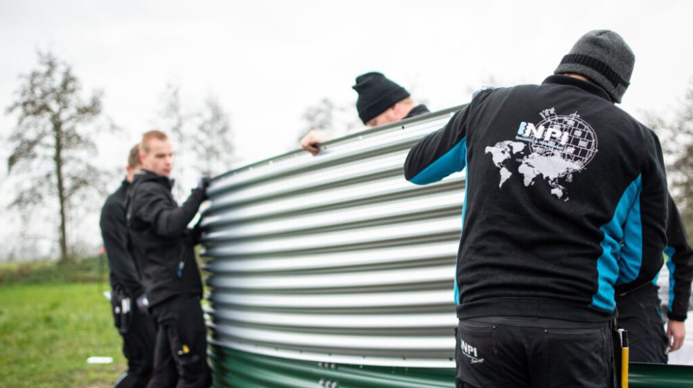 Installing a water tank at a local Christmas tree nursery, the Netherlands