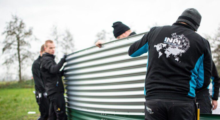 Installing a water tank at a local Christmas tree nursery, the Netherlands