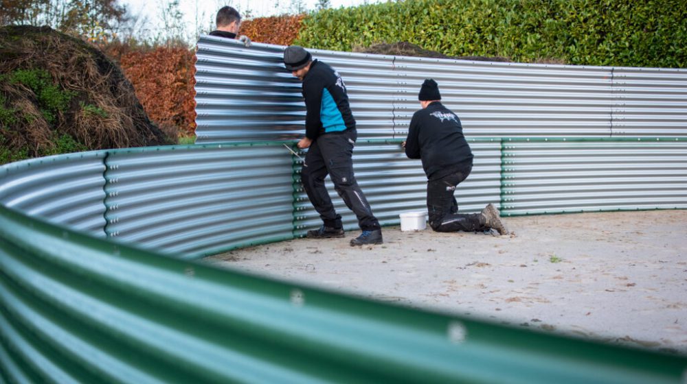 Installing a water tank at a local Christmas tree nursery, the Netherlands