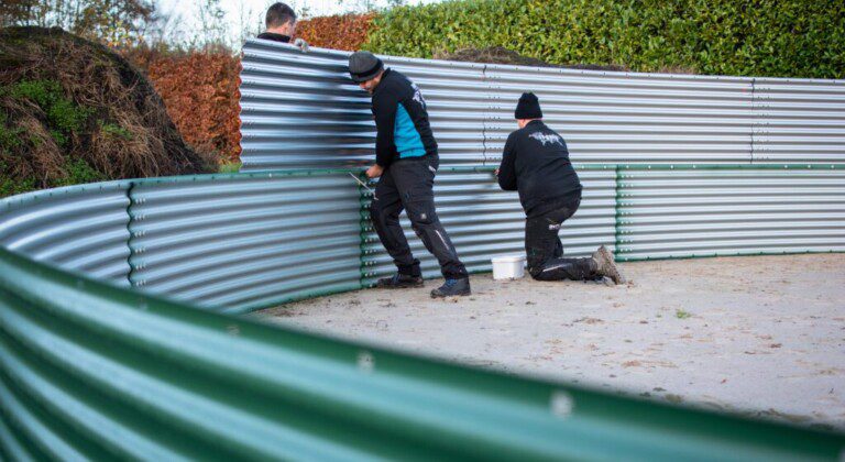 Installing a water tank at a local Christmas tree nursery, the Netherlands