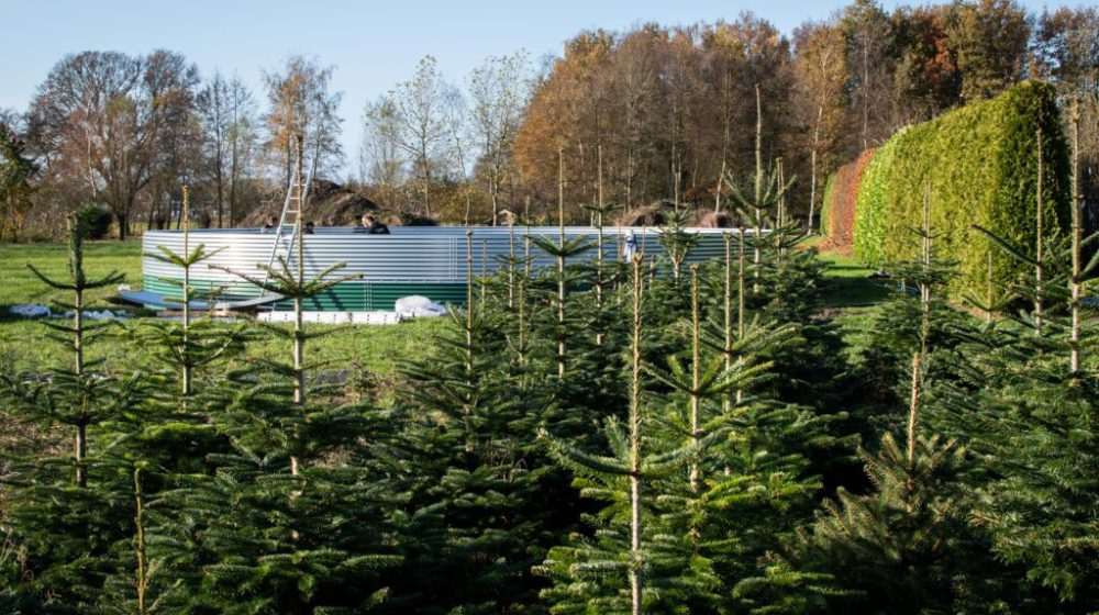Installing a water tank at a local Christmas tree nursery, the Netherlands