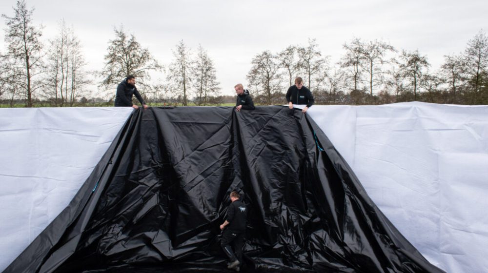 Installing a water tank at a local Christmas tree nursery, the Netherlands