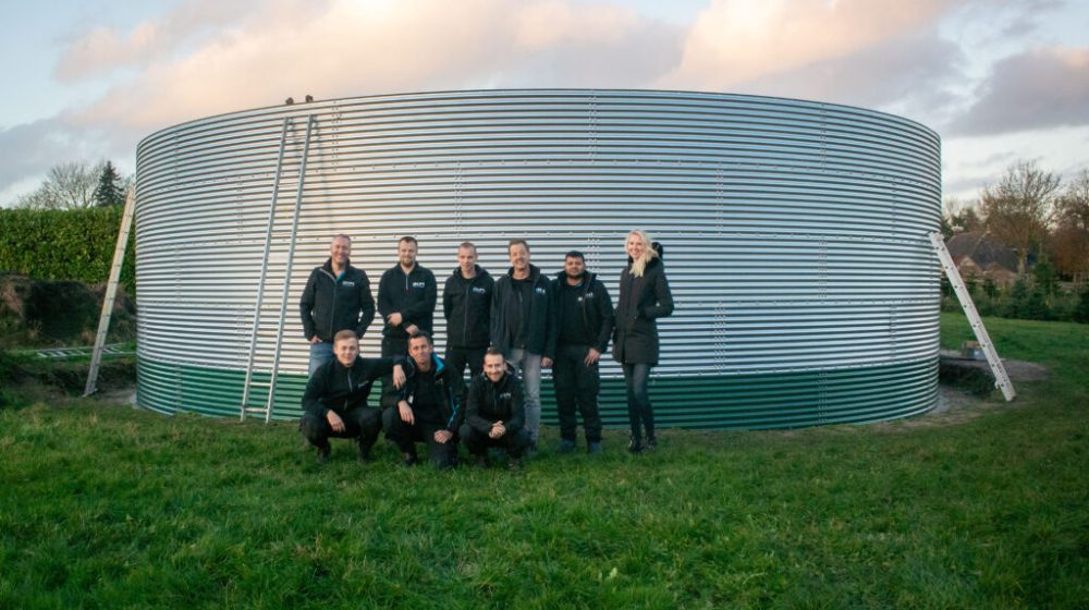 Installing a water tank at a local Christmas tree nursery, the Netherlands