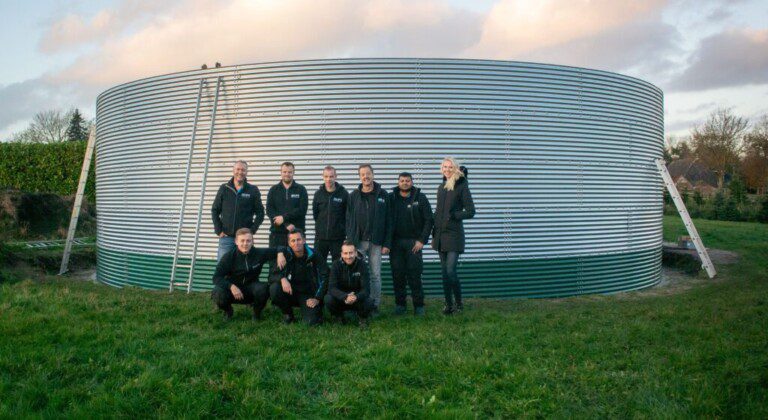 Installing a water tank at a local Christmas tree nursery, the Netherlands