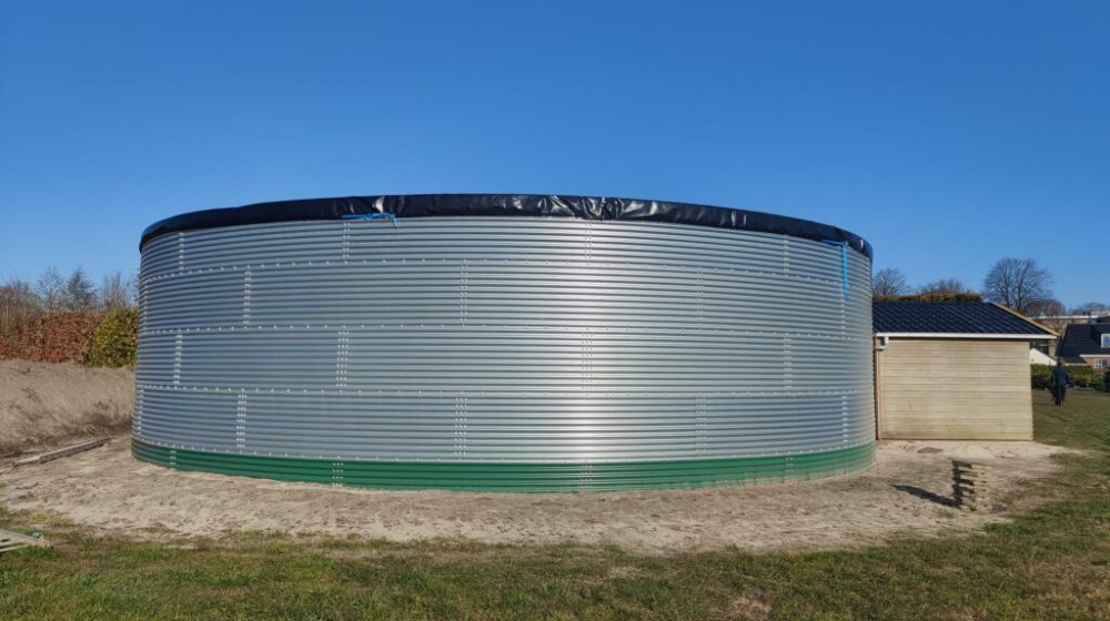 Installing a water tank at a local Christmas tree nursery, the Netherlands