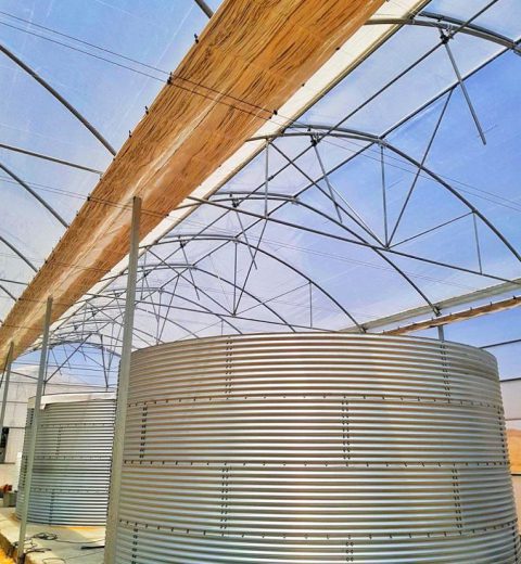 Water tanks for a plastic greenhouse complex, Iran